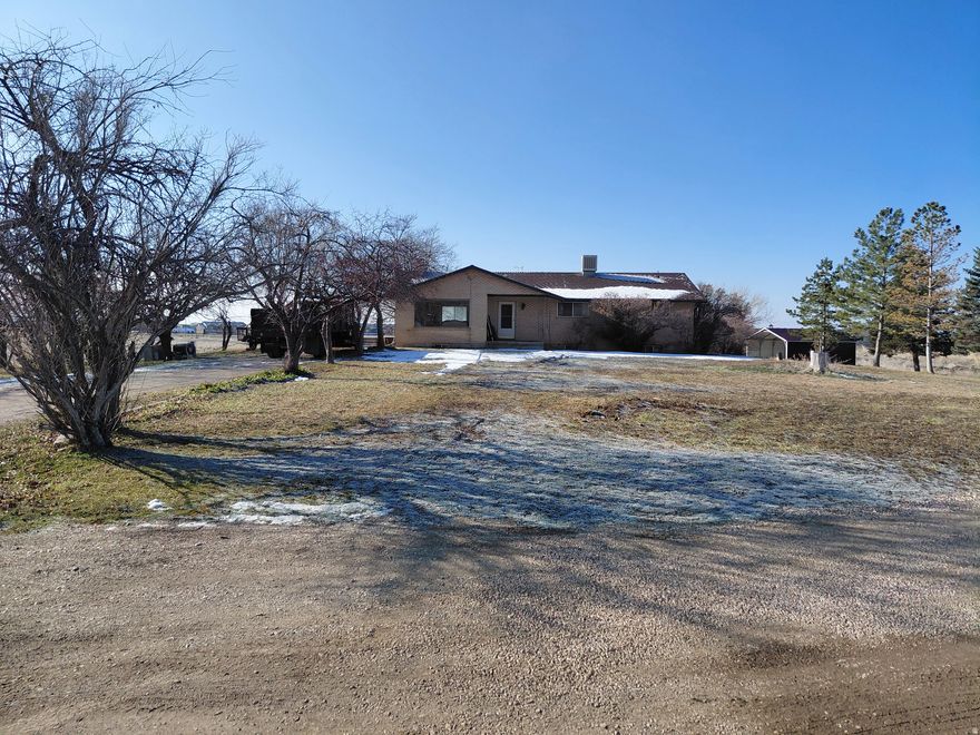 This home sits on 3.55 acres and has two other parcels (190160080, 190160008) that will be sold with it for a total of 7.56 acres. The property has been owned by the same family since 1977. Large home with a carport and large barn. Possible to subdivide since there is access on the South from Hwy 89 and Casey Lane on the North. Water source is a well. Has Septic System, Pleasant View City is currently installing a new sewer line that the home or other buildings could be piped to. Property is zoned RE-20. The North or East Fields are great for horses or cattle. A large barn is also on the property.