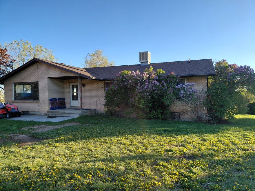 This home sits on 3.55 acres and has two other parcels (190160080, 190160008) that will be sold with it for a total of 7.56 acres. The property has been owned by the same family since 1977. Large home with a carport and large barn. Possible to subdivide since there is access on the South from Hwy 89 and Casey Lane on the North. Water source is a well. Has Septic System, Pleasant View City is currently installing a new sewer line that the home or other buildings could be piped to. Property is zoned RE-20. The North or East Fields are great for horses or cattle. A large barn is also on the property.