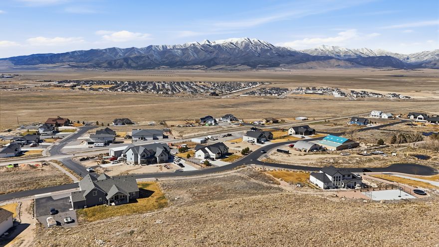 This verified buildable 1.59-acre lot in Glenmar Ranches offers stunning views of Cedar Valley and the Oquirrh Mountains.  Backing up to public land, it provides endless recreation opportunities right in your backyard. This lot is ready for your dream home, with plenty of space to design and build the perfect residence and landscape.   Horses are welcome in Glenmar, making this the ideal site for equestrian enthusiasts. As one of the last available lots in Phase B, it is surrounded by gorgeous custom-built homes, adding to the appeal of this exclusive community.   Don't miss this rare opportunity to create your dream home in a serene and scenic setting!!  Canyon View Credit Union offers lot loans with 20% down, a 30-year term, and a current rate of 6.49%. Estimated monthly payment is $1,850. For full details and qualification information, contact Taylor Riley at 801-201-9262.   **If you don't have your own builder and need a recommendation, the seller has teamed up with Revere Custom Homes to help you navigate the process. For more details about what Revere Custom Homes can build visit MLS# 2062046