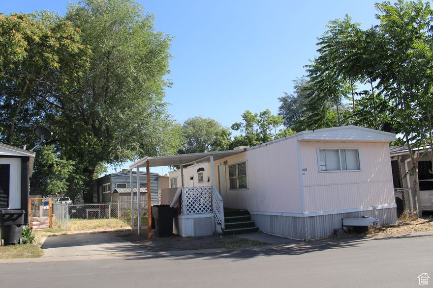 Charming 2-bedroom, 1-bath mobile home located at West Valley City  - just minutes from both the 215 and I-15 freeways for easy commuting. Low space rent of only $975/month makes this a great opportunity for affordable living. Conveniently located near shopping, dining, and schools. Don't miss your chance to own in a well-maintained community! measurement  provided as a courtesy: Buyer to verify all information. Don't miss out on this great opportunity!