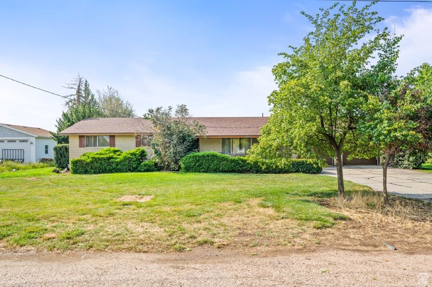 All-brick rambler situated on 1 acre of land. Home features a spacious updated kitchen, a cozy gas fireplace, and a newer roof. Enjoy year-round comfort in the 448 sq ft enclosed sunroom and relax on the covered back patio. Plenty of room for outdoor living and future possibilities.