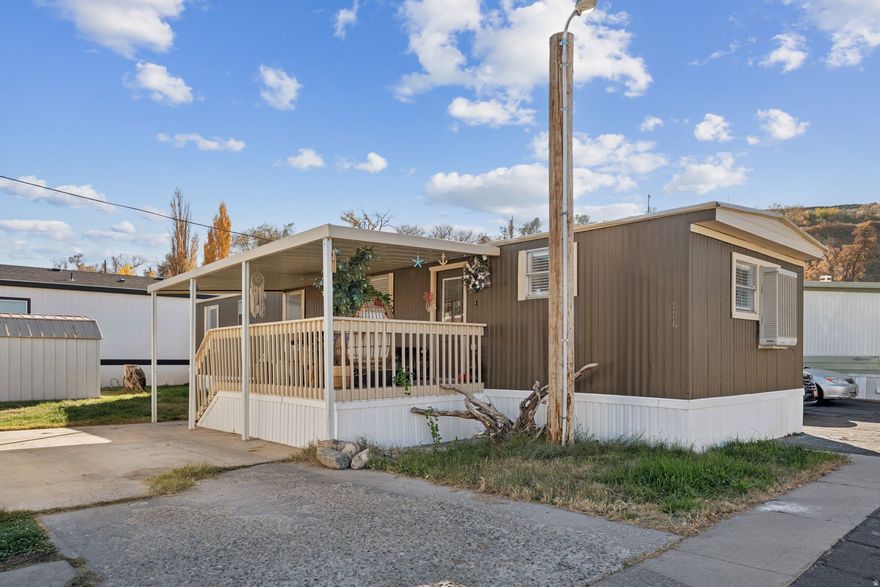 This darling Riverdale home has all the charm and updates you've been looking for! Featuring 2 bedrooms, 1 bath, and thoughtful renovations including new flooring, paint, lighting, kitchen finishes, and more, it's truly move-in ready. The quiet neighborhood offers mountain views and easy parking on both sides of the home. Located just minutes from shopping, great schools, Hill Air Force Base, and freeway access, you'll love the blend of convenience and comfort. Situated in a well-cared-for mobile home park, this home is perfect for anyone wanting an affordable, low-maintenance lifestyle in a great Northern Utah location. Home is on leased land; financing options may be available through manufactured home lenders.