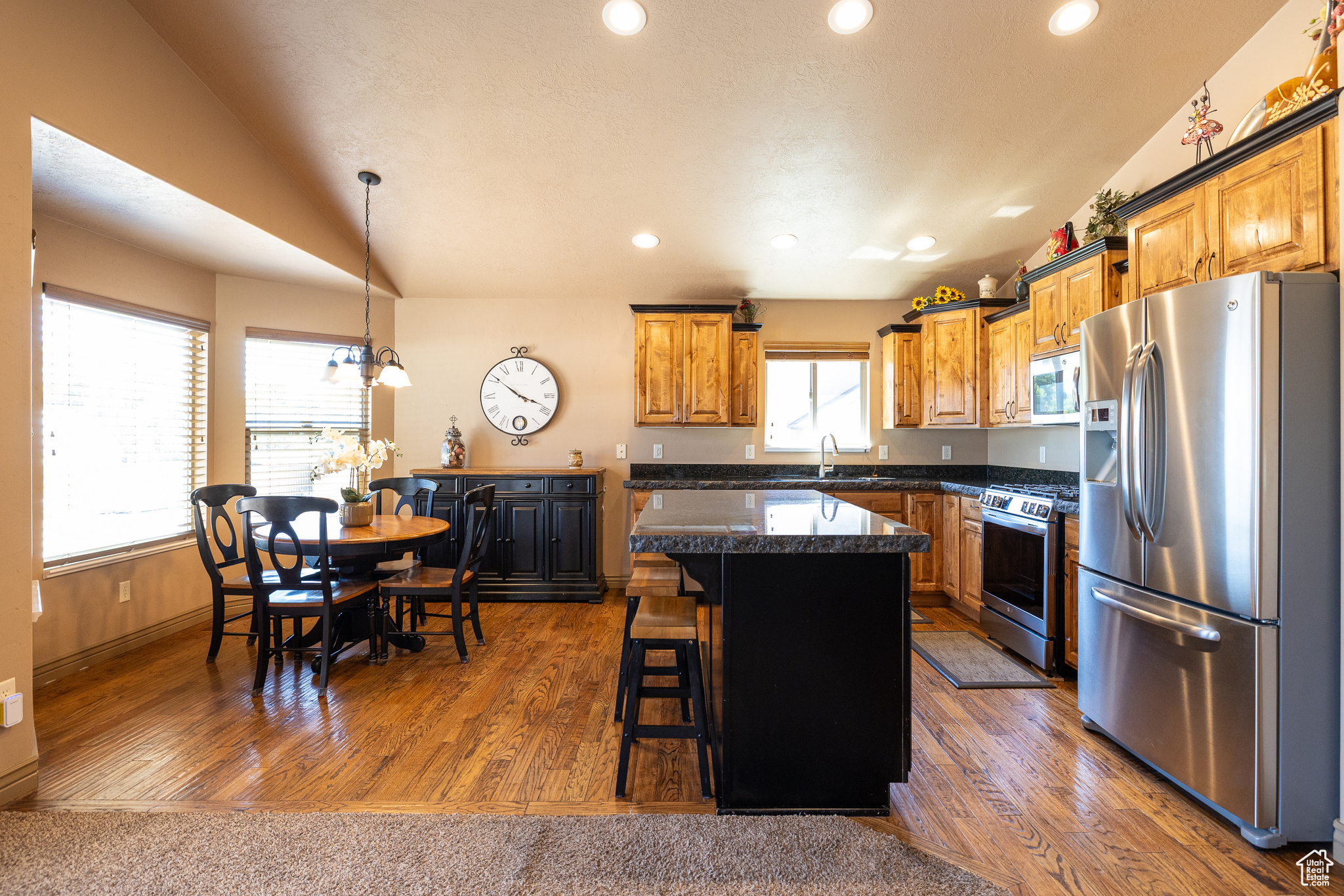 Welcome to this stunning 4-bedroom, 3-bath rambler located in the heart of North Ogden, Utah. This spacious home offers an open-concept great room perfect for entertaining, featuring a beautiful kitchen with rich cabinetry, granite countertops, and stainless steel appliances. Enjoy movie nights in the dedicated theater room or enjoy family time in the adjoining game room. Take advantage of the oversized 3-car garage for all your storage and parking needs. Large and shady east side yard. Nestled in a peaceful neighborhood, this home combines comfort and style with the convenience of nearby dining, shopping, and newly developed amenities that make North Ogden a vibrant and growing community. No HOA, Huge price reduction! Motivated sellers!!