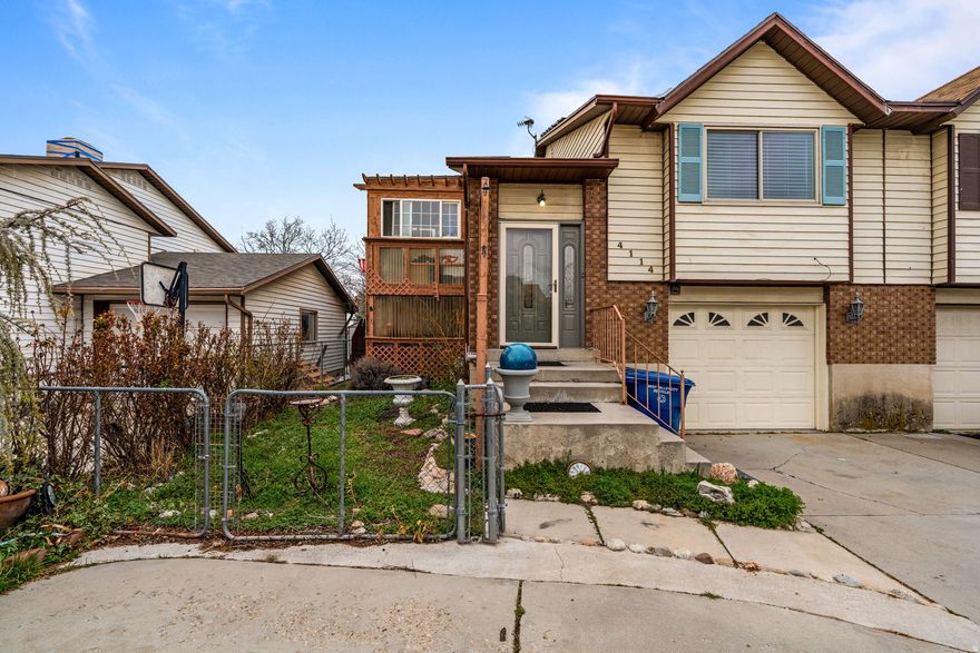 Four bedroom, two bathroom twin home with solar panels, private yard, and no HOA! Avoid the extra expenses of living in a townhome and get yard space too. Enjoy the additional extras like attic storage and the enclosed deck. Commute easily with quick access to Bangerter Highway and I-215. Enjoy the local shops and restaurants just minutes away. Schedule your showing of this home today!  All information is deemed accurate. Buyer to verify.