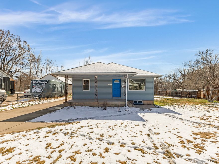 Charming bungalow on a Half-Acre. This 4-bedroom, 1-bathroom home has had all of the expensive updates done already. A new roof, new windows, and recently replaced electrical, sewer and water lines, combined with installed solar panels and updated HVAC.  Situated on a rare and sprawling half-acre lot in Clearfield, this property offers the perfect blend of space and efficiency. The main floor features brand-new flooring and fresh paint, highlighting a functional layout with two bedrooms, a kitchen, and a formal dining room perfect for gatherings. Two additional bedrooms in the basement provide the flexibility you need for a home office or guest quarters.