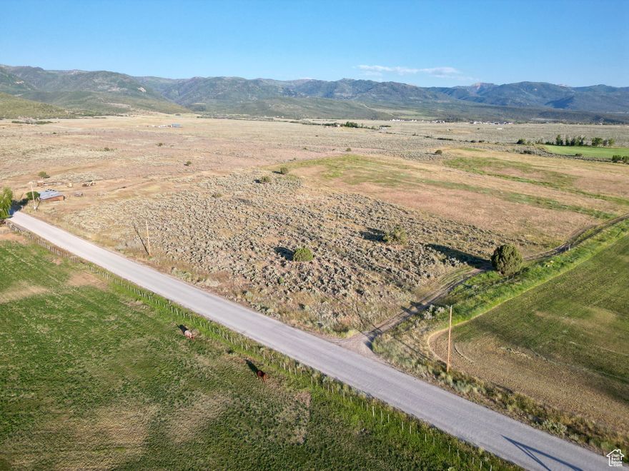 Nestled on 10.15 acres just outside the charming town of Mt. Pleasant, this prime piece of land offers the perfect blend of peaceful rural living with convenient access to town amenities. The property comes equipped with a well and a valuable water right, making it an ideal setting for residential development, hobby farming, or recreation. An existing outbuilding with power connected and faucet outlets provides a great head start for future improvements or use as a workshop or storage space. With ample room to build your dream home or potentially subdivide; the possibilities are wide open. Enjoy breathtaking mountain views, wide-open skies, and the freedom of country living just minutes from downtown Mt. Pleasant. Power is connected, property would require septic and propane. Address is shown as approximate. All information within is provided as a courtesy only.  Buyer and Buyer's agent to complete their own due diligence. Boundry and lot lines are shown as approximate.