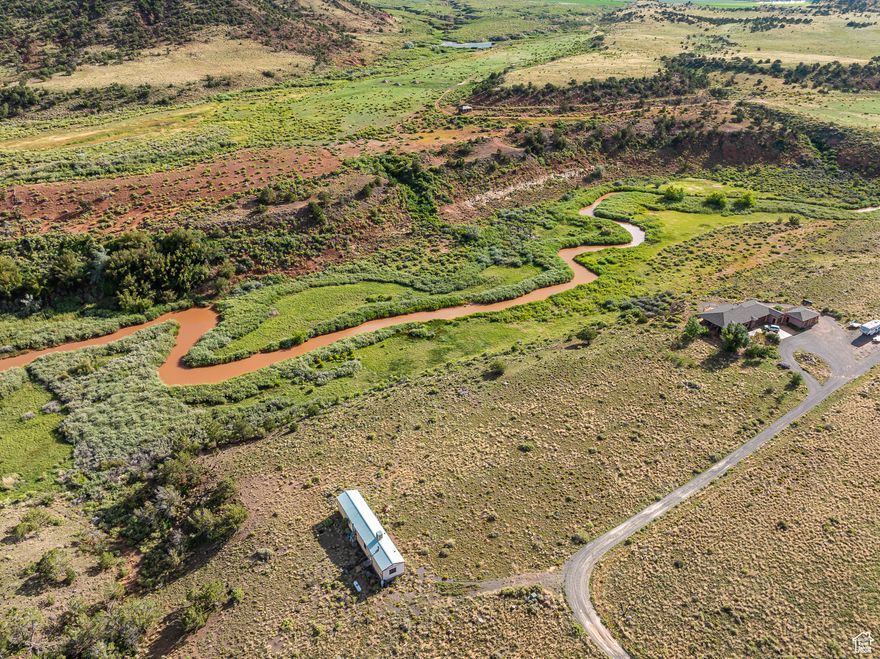 A River Runs Through It! Riverside Paradise in Torrey, Utah  Discover a rare opportunity to own a piece of Utah's stunning red rock country, where the Fremont River winds through your property. This one-of-a-kind parcel offers fishing in your backyard, animal life abounds, including deer, lizards, squirrels, beaver and a wide variety of birds. Plant life, native to the area, grows abundantly which includes wild grasses, cacti, rabbit brush, sage brush and willow with juniper trees & pinion pine growing across the river on BLM land. This property features unobstructed views of Thousand Lake Mountain peeking over dramatic red sandstone cliffs and Boulder Mountain. Property is build ready with power, well with well house and water rights, and septic system.   Surrounded by endless outdoor adventure, this property provides direct access to hiking, hunting, and scenic trails, making it an outdoor enthusiast's dream. With Capitol Reef National Park just minutes away and Boulder Mountain close by, you'll have a world of exploration at your doorstep. Whether you're trekking through striking slot canyons, fishing in alpine lakes, or viewing breathtaking rock formations from your deck, this land places you in the heart of it all.  After a day of adventure, indulge in five-star dining at some of the region's finest restaurants in Torrey and Boulder, where world-class cuisine meets the charm of the West. As the day winds down, prepare to witness some of the most amazing sunsets ever. When night falls, experience some of the darkest skies in the country, where the Milky Way stretches across the horizon in dazzling clarity. With minimal light pollution, this property offers unrivaled stargazing.    Whether you're seeking a private getaway, a riverside cabin site, or a long-term investment in Utah's awe-inpiring beauty, this land offers unparalleled serenity, adventure, and opportunity.  Don't miss your chance to own this rare Fremont River retreat! Contact us today for more details.  There is a mobile home on the property that is not habitable. Needs to be removed.