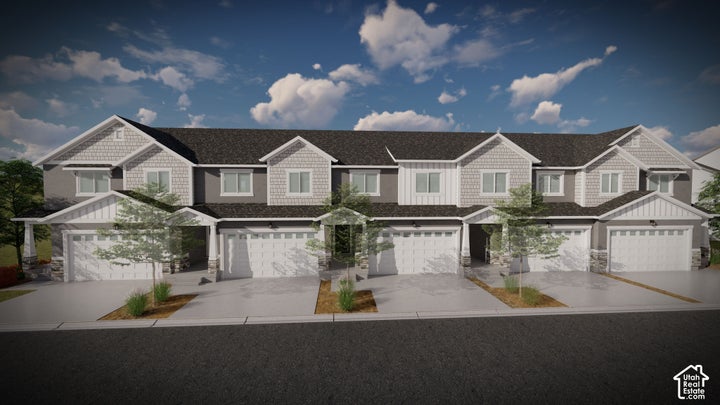 Contemporary townhome exterior featuring multiple gables, stone accents, and shake siding