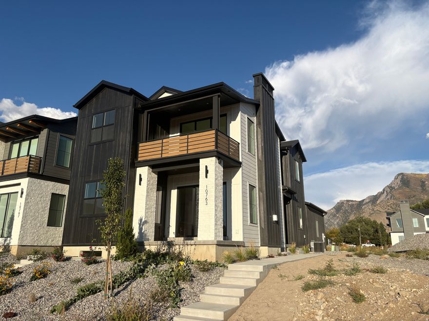 NEW HOME WITHOUT THE WAIT!!! This beautiful 2-Story home sits in one of Highlands' newest communities, TEN700. With close proximity to schools, shopping and mountain trails you have convenient luxury living combined with low maintenance. The open floor plan with custom wood cabinetry, built-in oven and microwave and quartz countertops has you feeling right at home the minute you enter the home. The primary suite offers a large bathroom with a freestanding tub and large shower as well as a balcony where you can watch the sunsets at night. There is amble space for guests to stay or if your family is growing and you need more room. The neighborhood is quaint and quiet with beautiful views of the mountains.