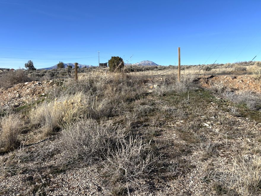 Freedom from deed restrictions or covenants on this priced to sell building lot in Blanding Utah. Almost an acre of land with electricity installed in the center of the lot. Plenty of buildable areas. Slightly outside the Blanding city limits. There is a drainage ditch on the west side of the lot. The address is estimated pending county assignment.   Buyer to verify all information.