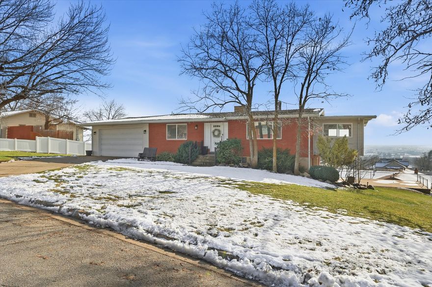 Welcome to this beautifully updated rambler with stunning mountain and valley views! The main level features a bright and open floor plan, perfect for gatherings with family and friends. The updated kitchen is a dream, showcasing custom cabinets, granite countertops, and stainless steel appliances. You'll love the thoughtfully designed layout in the basement, including a salon with a direct walk-out to the patio, which is ideal for a home business, creative space, or easily adaptable to fit your family's needs. Enjoy the convenience of a 2-car attached garage and also a rare 2-car detached garage- perfect for extra vehicles, toys, or a workshop. Close to hiking, biking, and walking trails, and just minutes away from world-class ski resorts.