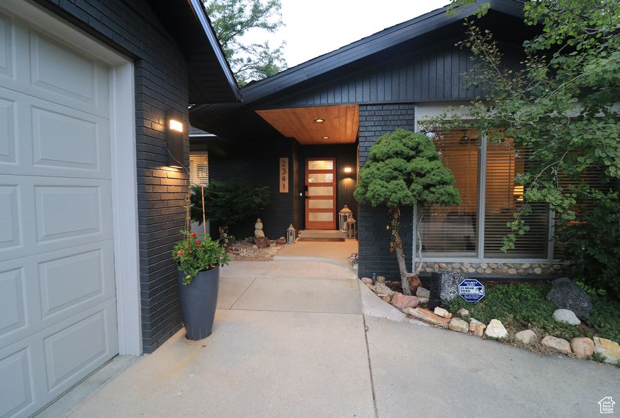Exquisite East Millcreek Retreat! Tucked away behind mature trees, this elegantly remodeled residence blends timeless design with modern upgrades. Inside, discover premium finishes, solid core doors, and a spacious garage, along with countless high-end improvements throughout. A full mother-in-law apartment with private entrance and laundry offers versatility for extended family or rental income. Perfectly positioned near Evergreen Park, the library, and the recreation center-plus just minutes from Millcreek Canyon and world-class ski destinations. A rare opportunity in one of East Millcreek's most sought-after neighborhoods.! Aligned Showings Link Schedule a Showing. 2 PARCELS MAKE UP THIS PROPERTY 16-35-203-009 AND 16-34-203-008