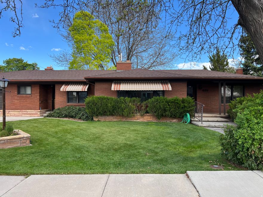 Charming, impeccably maintained 1956 brick home offering 5 bedrooms and 2 bathrooms in an unbeatable location right around the corner from the swimming pool, walking paths, and community amenities! Lovingly cared for through the years, this home is incredibly clean and full of timeless character, featuring a cozy rock fireplace, and endless charm throughout. Outside, you'll enjoy a beautifully kept fully fenced backyard with a covered patio perfect for relaxing or entertaining. The front yard even offers a fantastic spot to watch the Fourth of July fireworks each year! A rare opportunity to own a solid, well-cared-for home in a wonderful neighborhood with endless potential.