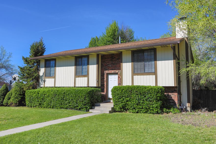 This inviting and well-maintained home offers comfort, space, and convenience-ideal for a small family or first-time buyers. Situated on a desirable corner lot in a quiet dead-end street, it provides privacy and a peaceful neighborhood feel. Inside, enjoy newer paint and flooring throughout, a cozy family room with wood-burning fireplace, central air, and washer/dryer hookups. The kitchen includes a newer refrigerator and stove.   Outside features a large fully fenced backyard with a spacious deck for entertaining. Additional perks include a painted two-car attached garage, new 50-gallon water heater, and extra storage. Minutes from I-15-move-in ready!  All information, figures, and documentation provided as a courtesy, buyer to verify all information.