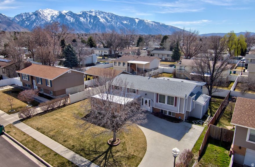 Fantastic split-level home with mountain views and a versatile layout designed for everyday living. Larger than most split-level homes in the area, this home offers additional space where it matters most. The sunroom just off the kitchen provides a light-filled space to relax or entertain, while the kitchen's curio cabinets with built-in lighting add warmth and character. Situated in a sought-after neighborhood with highly rated schools, you'll enjoy a quiet setting that's still just minutes from shopping, dining, and daily conveniences. Convenient access to both freeways (approx. 7 minutes) and only 15 minutes to the mountains. The third basement bedroom is exceptionally large and easily serves as a second family room or bonus living area.