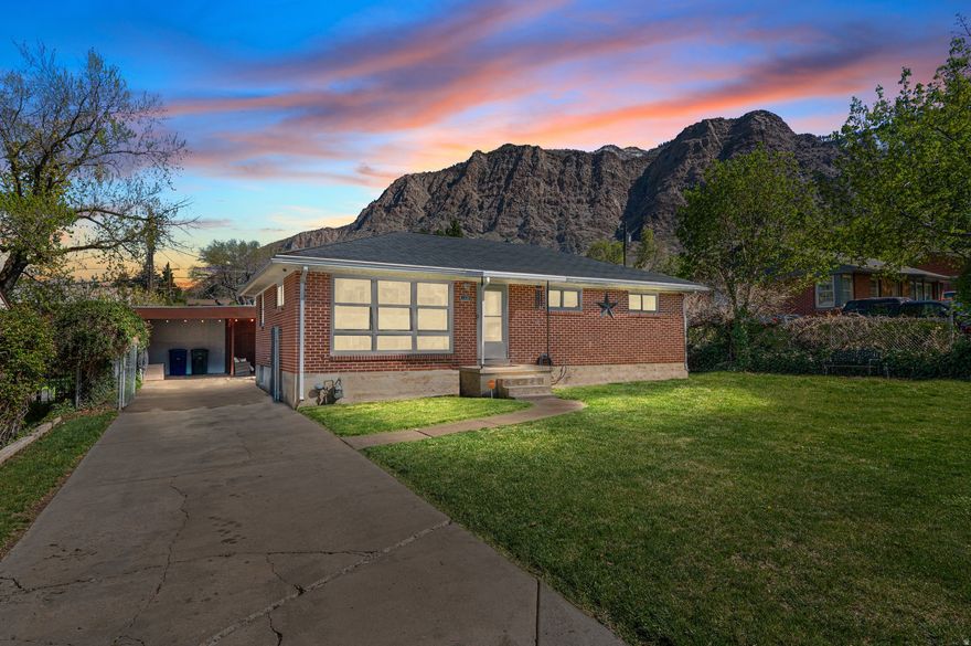 Charming rambler located on the desirable East Bench of Ogden, offering 5 bedrooms and 2 bathrooms with over 2,000 square feet of living space. This home features a functional layout with a dedicated laundry room complete with a laundry chute, sink and built-in workstation.  This home also has a metal roof, newer windows, and a newer water heater-providing both efficiency and peace of mind. Step outside to a fully fenced and landscaped private backyard, perfect for relaxing or entertaining.  Enjoy stunning mountain views right from your own property, all while being conveniently located near local amenities, outdoor recreation, and everything the east bench lifestyle has to offer.  Square footage figures are provided as a courtesy estimate only and were obtained from COUNTY WEBSITE.  All information is deemed accurate by all parties but Buyer is advised to verify all information and obtain an independent measurement.