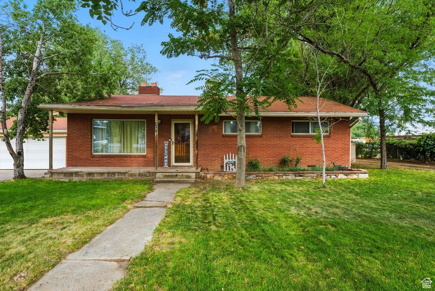 NEW PRICE!! WOW!! RARE FIND!!!  OVER AN ACRE in WEST JORDAN! HORSE PROPERTY! All Brick Home w/Detached Garage! Backs to the Canal for Privacy! Fenced! Mature Trees! Outbuildings! May be a subdividable possibility.  Zoned Single Family Homes.