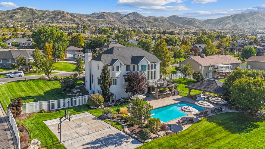 Rare one-acre, turn-key property in prestigious corner canyon neighborhood surrounded by large lot homes on a "no-outlet" street in Draper. Gorgeous panoramic views of the Wasatch Mountains. Buy for the location and land while getting a beautiful, fully updated home inside and out: interior/exterior paint, newer roof, new windows, humidifier, new automatic pool cover, chefs kitchen and more. Entertainers dream backyard with a salt-water pool, large custom gazebo, pizza oven, sports court, fire pit, outdoor kitchen and plenty of parking. Large weddings and events hosted here with ease. Fully landscaped but could easily converted back to horse property.  Key features include: Corner Lot with easy access to the front AND back of property. Secluded. You could build on the back 1/2 acre while living in the house. Already zoned for livestock so bring your hobby farm. Full mother-in-law with a walkout basement.  These large lots in the area rarely come on market and don't last long. Home is prepped and easy to show.  Information deemed reliable but buyer to verify.