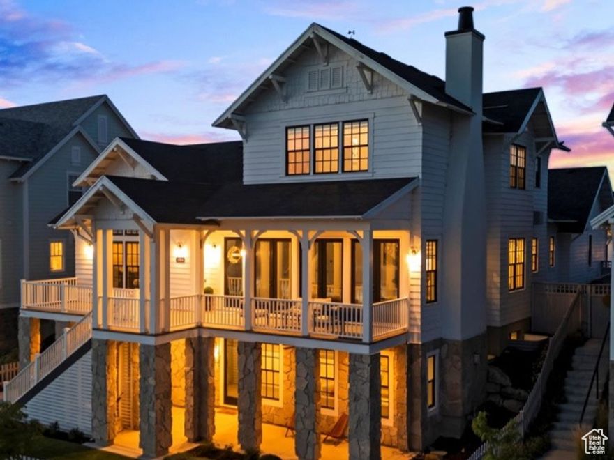 Rarely available! Stunning lakefront residence on Daybreak Island. Spectacular lake and mountain views. Sophisticated design, extraordinary details. Magnificent great room features striking Italian tile fireplace and exposed beams creating dazzling masterpiece. Culinary dream kitchen showcases Viking range, exquisite quartz counters, butlers pantry displays rich wood paneling. Designer lighting, impressive details and finishes curated for luxury living. Main level primary retreat is a sanctuary of indulgence offering mesmerizing vistas, a spa-inspired bath, custom walk-in closet Three additional en-suites offer gorgeous private baths. Spectacular walk-out lower level includes sensational entertainment retreat. Additional spaces perfect for future second kitchen, home theater and more. Splendid guest suite or accessory apartment. Wonderful fenced yard complete with additional patio. Oversized three car heated garage, epoxy flooring. The Island At Daybreak offers extraordinary waterside living! Exceptional amenities include lakeside pavilion, sandy beaches, firepits, and paved walking trails surround the lake. Residents enjoy complimentary kayaks, canoes, sailboats and paddle boards. Downtown Daybreak is vibrant mix of businesses and home to Salt Lake Bees stadium, restaurants, concerts and more! This luxurious waterfront home is truly a crown jewel on Daybreak Island. More than just a residence, it's an elevated lifestyle. 11064PaddleBoardWay.com