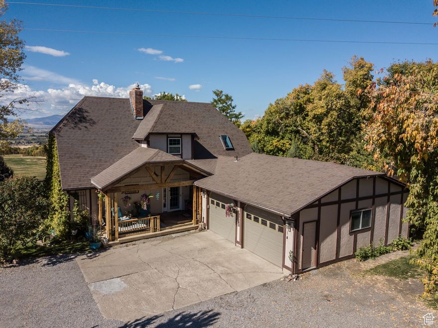 Incredibly located beautiful chalet style home in Richmond only 4 minutes from Cherry Peak Ski Resort with amazing valley views and 1.58 acres of wonderful wooded privacy!  3,506 square feet, 5 bedrooms, 3 bathrooms, 3 family rooms, large windows for natural light, updated kitchen, walkout basement, 2 decks, 2 car garage and much more!