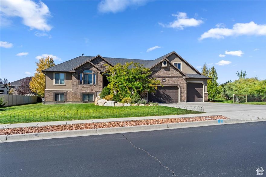 Spacious 6-Bedroom Home with Extra Parcel and Stunning Views! Country living, only 20 minutes to HAFB. Welcome to this expansive 6-bedroom, 3.5-bath home built in 2012, offering comfort, versatility, and room to grow. Situated on a generous .86 acre fully treed and landscaped property, with landscape lighting and an additional adjoining parcel, providing enough space for a horse property, or a separate building lot. Inside, you'll find a thoughtfully designed layout with large living spaces, a bright open kitchen, and both electric and gas hookups for your range and dryer. The primary suite offers a private retreat, while multiple bedrooms and bathrooms ensure ample space for family, guests, or a home office setup. Electrical and plumbing is in place for a second kitchen downstairs. The home is a tech lover's dream with a com room, security cameras, dual Cat6 drops in every room, Crestron automation and more. Step outside to enjoy a beautiful deck with sweeping views and a spacious yard perfect for entertaining, gardening, or outdoor recreation. The oversize garage boasts exceptional height, length, and width, ideal for storage, workshop use, or larger vehicles. This property combines modern convenience, flexible space, plenty of privacy, and a rare opportunity for added value. The additional .41 acre parcel contains a custom built cabin/shed combo with a loft and finished interior. The adjacent fire pit area is perfect for outdoor entertaining. Don't miss your chance to make it yours! Schedule your showing today! **INCLUDED Second 0.41 acre parcel is Tax ID 19-339-0024, annual taxes are $89**