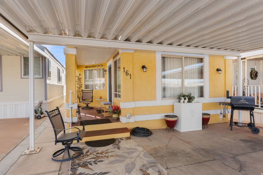 Stunning decorated design is what you will see when you enter this perfect second or retirement home. Custom paint throughout, new draperies with rods and new efficient HVAC & PRV in 2025. Full-size updated kitchen features pull-out shelving and lazy-susan. Generous living space includes bedroom, walk-in closet, large pantry, and with comfortable dining area. Dedicated laundry room, workplace office space and lovely bathroom with a designer touch. This Doll House is professional re-designed offering comfort and luxury living in a generous space of 710 sq. ft. with a large 8' by 10' storage unit with security light and exhaust fan. Low HOA of $105 a month, includes enclosed pool, hot tub, 2 clubhouses, sewer, water, garbage and more. A must to see.