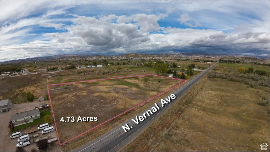 Great Opportunity on North Vernal Avenue.  Check out the possibilities for this 4.73 acres.  Buyer is advised to check on utilities and other information.  Land is on Greenbelt.