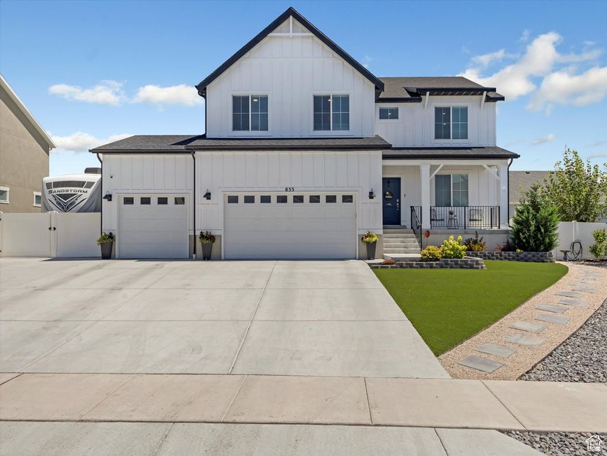 This immaculate Topaz floor plan is packed with sought-after upgrades, combining style, comfort, and functionality. Step inside to find a dedicated mudroom and spacious open-concept living areas designed for modern living. The main floor features a private office with elegant French glass doors-perfect for working from home or quiet study. The chef's kitchen impresses with soft-close white cabinetry topped with crown molding, upgraded quartz countertops, double ovens, stainless steel gas appliances, and a large island ideal for gatherings. Enjoy 9' ceilings and beautiful laminate flooring throughout the main level, with waterproof luxury vinyl plank in baths and laundry for added durability. Upstairs, the luxurious primary suite offers a spa-inspired bath with dual vanities, soaking tub, and walk-in shower. A versatile loft provides extra space for lounging or play. The light-filled unfinished basement is ready for your personal touch. Outdoors, the low-maintenance yard shines with AstroTurf lawn, vibrant flower beds with drip irrigation, an expansive patio, and fenced RV parking. Located in a vibrant community with a pool and open green spaces!