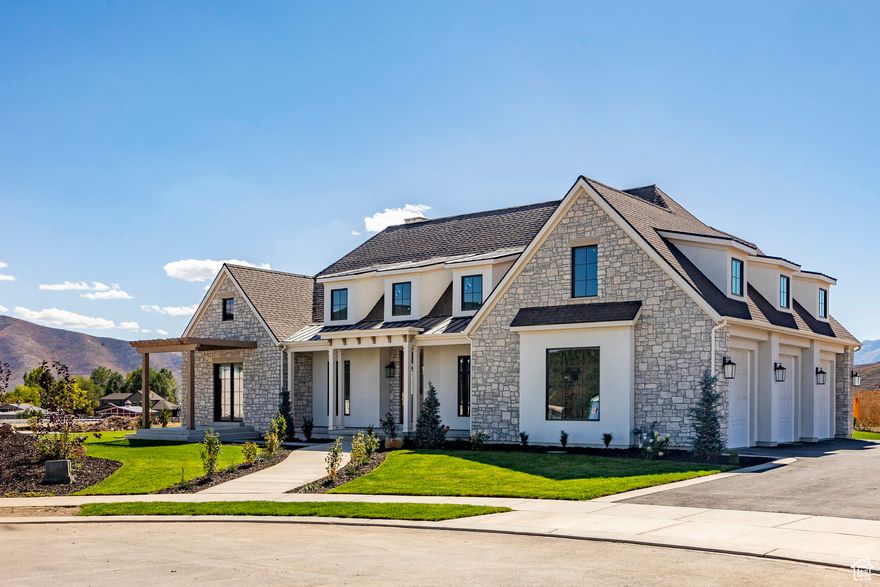 Presenting an exceptional new construction home at 95 W. Bridlewood Lane in Midway's Saddlecreek neighborhood.  This beautifully designed residence sits on a 0.50-acre parcel at the end of a cul-de-sac, offering a spacious setting with luxurious finishes throughout.  The home features a well-appointed main level, highlighted by a master bedroom suite for ultimate convenience and comfort. The open-concept living area flows seamlessly into a chef's kitchen, perfect for both daily living and entertaining. Enjoy the outdoors with a covered patio, offering an ideal space for relaxing or dining alfresco.  Additional highlights include a 3-car garage for ample storage and a finished basement with a family room and wet bar-perfect for gatherings and entertainment. Every detail of this home has been carefully considered, creating a perfect blend of style and functionality.  With its charming design and high-end finishes, this property is a standout in the desirable Saddlecreek community in Midway. Don't miss the opportunity to make this stunning home your own.