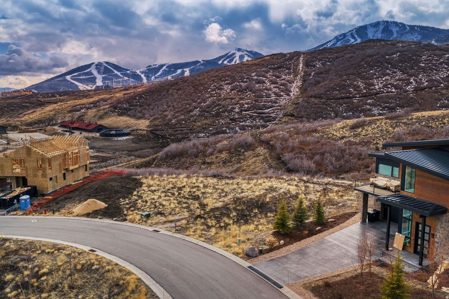 Design and build your luxury mountain retreat on this 0.19-acre homesite in the Orion subdivision of SkyRidge. Featuring ski run and lake views of Jordanelle Reservoir and bordered by open space, this flat lot offers privacy, protected sightlines, and an ideal building envelope. Situated in a largely completed section of SkyRidge, the property benefits from minimal future construction disturbance.  SkyRidge spans approximately 670 acres and is a premier golf and equestrian community affiliated with Deer Valley Resort. Nightly rentals are permitted, creating strong potential for a vacation rental or investment property. The homesite is minutes from Deer Valley East Village, offering access to world-class skiing and expanded resort amenities, as well as boating and recreation at Jordanelle Reservoir.  Planned and developing community amenities include a clubhouse with caf, fitness center, resort-style pool, golf academy, equestrian facilities, and private trails for four-season living.  Enjoy convenient access to Park City Historic Main Street, Kimball Junction, and direct routes to Salt Lake City and Salt Lake City International Airport, making this an ideal primary home, second home, or investment opportunity near Deer Valley.