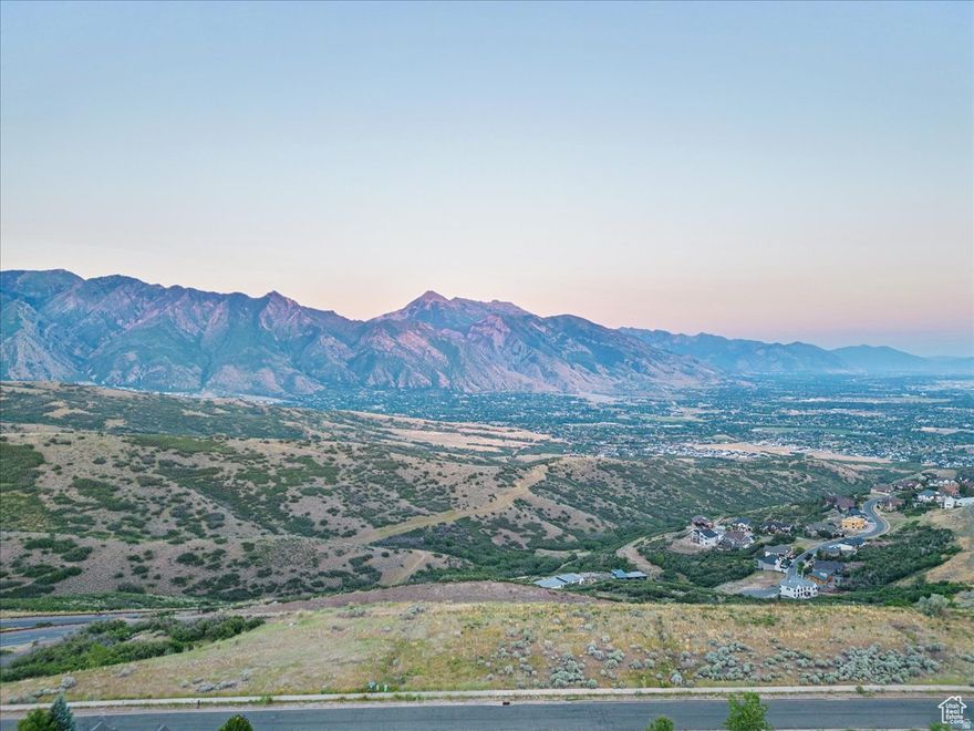 Build your dream estate and enjoy unobstructed views of Utah Lake, Mt. Timpanogos, and Lone Peak in Draper's Mountain Community of SunCrest.  The abutting conservation easement to the South ensures the only back yard neighbors you will ever have are abundant mountain wildlife. Listing includes two lots which can be combined for a total of .348 acres.  This location offers a rare opportunity to build where captivating scenery takes center stage, while offering the convenience of easy commutes: 8 minutes to I-15, 30 minutes to the international airport and downtown Salt Lake City, 35 minutes to world class skiing/riding. The allure of this property extends beyond its stunning views and location. With world-class hiking and mountain biking from your door, don't miss the opportunity to call this mountain paradise your own. Embrace a lifestyle defined by extraordinary views and serenity. This listing includes tax IDs 38-334-0110 and 0109.  Initial GeoTech Engineering report is attached to the MLS. Available information indicates stabilization required of these lots.  All info provided as a courtesy. Buyer/Buyer's Agent to verify all.
