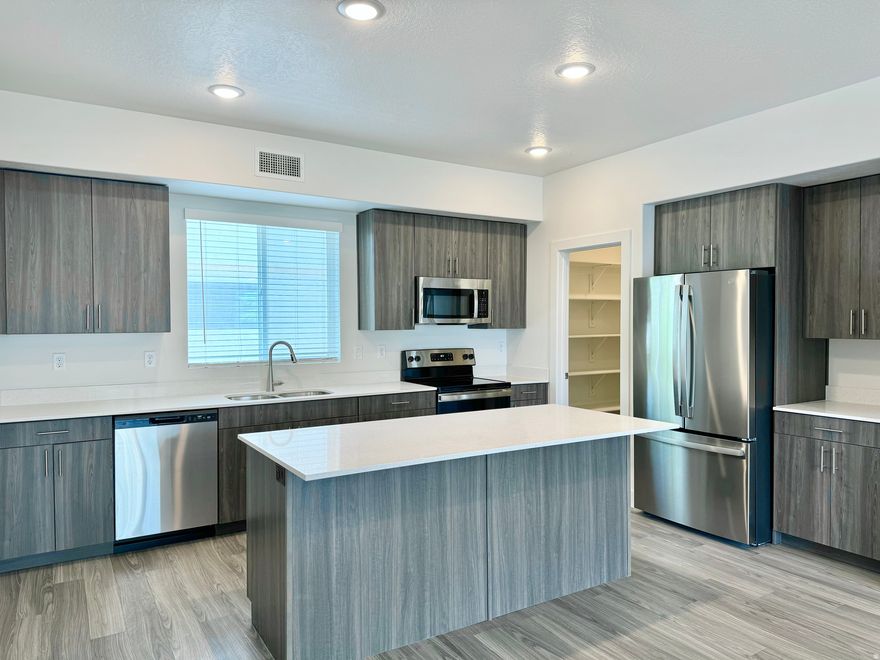 ***PRICE REDUCED THROUGH END OF YEAR*** Last chance to own one of the best values in Weber County. ONLY TWO LEFT IN THE ENTIRE COMMUNITY! Homes are fully loaded with washer, dryer, fridge, window coverings, and all standard appliances. Homes are also very smart with tech throughout like smart lighting, thermostat, garage, keypad, and doorbell. HOA provides FIBER internet at no additional charge. Enormous garage fits full sized trucks. Come make this final unit yours today! Square footage figures are provided as a courtesy estimate only and were obtained from county records. Buyer is advised to obtain an independent measurement.