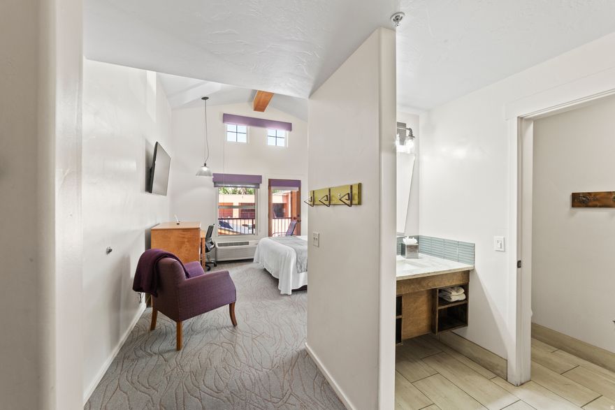 Downtown Moab Condotel Investment at the Gonzo Inn  Rare opportunity to own a fully furnished 2-bedroom, 2-bathroom condotel unit at the Gonzo Inn, located in the heart of downtown Moab. This income-producing property offers the perfect combination of investment potential and personal getaway, with professional on-site management available. The spacious unit features dramatic vaulted ceilings, two private balconies, and stunning views of Moab's iconic red rock cliffs. Designed for comfort and relaxation, the interior includes a bright living area, wet bar, and thoughtfully furnished spaces ideal for guests or owners alike. Owners and guests enjoy resort-style amenities including a pool and hot tub, all just steps from Moab's vibrant downtown shops, restaurants, and adventure outfitters. Arches National Park, world-famous mountain biking trails, hiking, and off-roading are only minutes away. Whether you're looking for a turnkey short-term rental investment or a personal Moab retreat, this unique condotel opportunity places you in one of the most desirable locations in town.