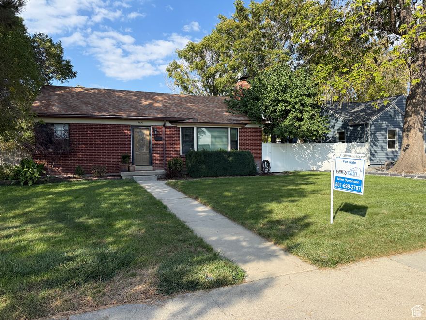 Stunning Home in Highly Sought-After Central Location!  Welcome to this beautifully maintained brick rambler home nestled in one of the most desirable and centrally located neighborhoods in Murray. This charming property seamlessly blends classic character with thoughtful modern updates-perfect for both everyday living and effortless entertaining.  Step inside to an open, sun-filled layout featuring hardwood floors, elegant moldings, and an abundance of natural light throughout. The spacious, newly updated kitchen is truly the heart of the home, boasting sleek countertops and ample cabinetry-ideal for cooking, hosting, or enjoying casual meals with family and friends.  Downstairs, the finished basement offers brand-new carpeting and versatile space that can be used as a media room, home gym, playroom, or whatever fits your lifestyle. There's also generous storage to help keep everything organized.  Outside, French doors open to a large back deck and beautiful yard-perfect for barbecues, gatherings, or simply relaxing in your private outdoor space. A detached double-car garage provides plenty of room for parking and additional storage.  Don't miss this rare opportunity to own a move-in ready home in a truly unbeatable location!