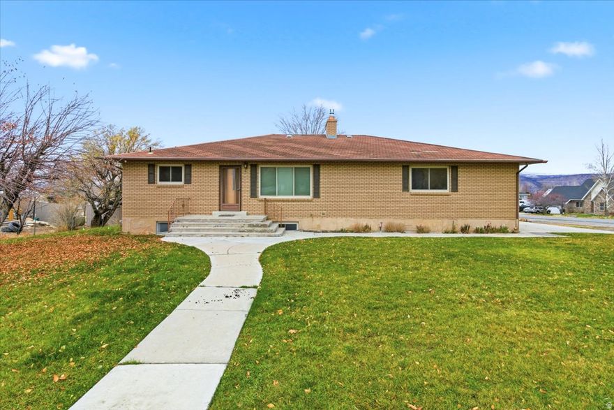 Nestled on a charming corner lot in a quiet, well-established community, this beautiful brick single-family home offers comfort, space, and convenience. Featuring three spacious bedrooms and two full bathrooms, it's ideal for families or those seeking room to grow. The fully landscaped yard enhances curb appeal and provides a serene outdoor retreat. A full basement with its own exterior entrance adds versatility-perfect for storage, a workshop, or future expansion. With both a two-car attached garage and a detached one-car garage, there's ample room for vehicles, hobbies, or extra storage. This property blends classic style with practical amenities in a peaceful neighborhood setting.  It may be possible to use the basement as a separate living space due to the extra garage and the outside entrance.