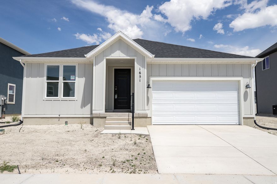 INTEREST RATES STARTING AS LOW AS 4.99% with our preferred lender or AMAZING $20,000 INCENTIVE TOWARDS CLOSING COSTS, RATE BUYDOWN, OR PRICE REDUCTION REGARDLESS OF LENDER! (Talk to agent for conditions). Must-see Parkway Fields Community in Eagle Mountain! Move-in ready! This beautiful home built by Flagship Homes features 3 bedrooms, 2 bathrooms, quartz slab countertops, painted cabinets, laminate flooring on the main level, vaulted ceilings on the entire main level, landscaped front yard, decorative concrete wall on the rear of property, 2 car garage, and backyard (can be landscaped for an additional charge). The primary bedroom has a vaulted ceiling, large walk-in closet, and dual sinks with a separate tub/shower. With an unfinished basement, this home provides space for storage and room to grow. (If preferred, basement can be finished for an additional charge.) Call for more information or stop by our model home at 1546 E. Starling Lane, Eagle Mountain for a tour. Model home hours: Monday-Saturday 11 AM - 6 PM. Buyers to verify all information. Square footage is from house plans.