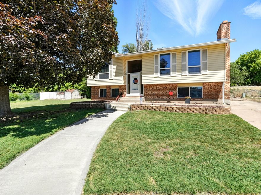 Welcome to this beautifully updated home tucked away in a quiet Roy cul-de-sac! With modern updates throughout-including new flooring, a updated kitchen with granite countertops, and an inviting layout. The living room features a cozy brick fireplace and large windows that let in tons of natural light. Downstairs, the oversized primary suite offers a second fireplace and plenty of space to relax or work from home. Step outside to a spacious backyard with a raised deck-perfect for entertaining or soaking up the sunshine. Located just minutes from parks, schools, and shopping, this home is the perfect blend of comfort and convenience