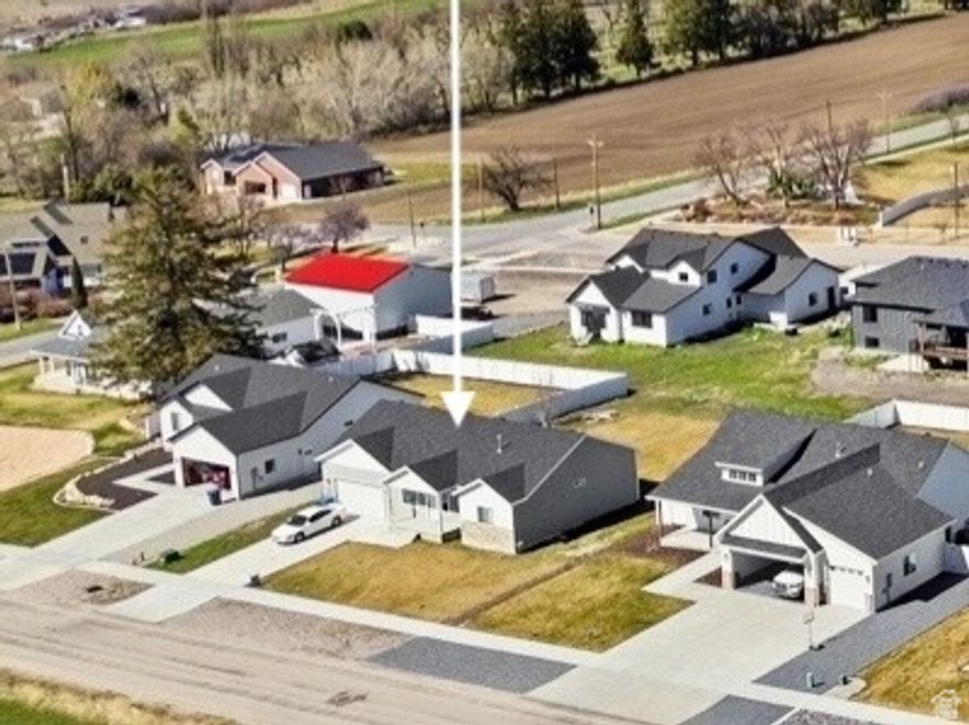 FIRE SALE: APPROVED SHORT SALE PRICE from $498,000. to $443,871. WOW!: Certified Appraisal at $480K and BPO at $519K. Seller is approved for the Short Sale, just need a buyer's offer by 5/5/26 or approval process will have to start all over!  Richmond's scenic east bench in Traveller Lane.  Spacious home blends desirable design, features and floor plan with large bedrooms (3 on main) and laundry room (main).  Basement is 50% finished and plumbed for a second kitchen last year.  Vaulted ceilings, granite countertops, a great room, large bedrooms and a fab location.  Breathtaking views, flat/spacious yard and fast access to Cherry Peak Resort for year round fun. Are you ready to 'cache' in?  Call for details how and what a short sale is and how you can purchase this home.  USDA 0% down payment programs available.