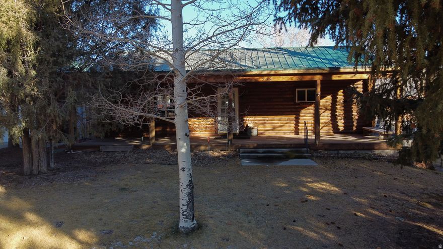 Comfortable cabin partially furnished with pellet stove in a fantastic location! Nestled in the quiet ranching community of Fremont, this charming cabin offers a peaceful Southern Utah lifestyle with access to some of the best hunting and fishing in the state. Enjoy close proximity to Fish Lake National Forest, Boulder Mountain, and Capitol Reef National Park. Perfect for outdoor enthusiasts and nature lovers alike. The property features inviting outdoor living spaces ideal for relaxing or entertaining, along with an open and comfortable living and dining area inside. Situated on a beautifully landscaped .67-acre lot, the property includes a sprinkler system and a share of irrigation water. Ample storage and workspace are provided with a detached garage, workshop, and shed, making this an ideal full-time residence, getaway cabin, or recreational retreat. Select furniture, riding lawn mower, and appliances are included. Square footage figures are provided as a courtesy estimate only and were obtained from county records .  Buyer is advised to obtain an independent measurement.