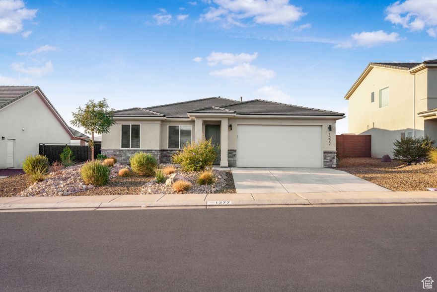 Completed in 2022, this one-owner home is dialed with thoughtful upgrades. Featuring 3 bedrooms plus an office and 2 baths, the open design shines with a beautifully upgraded kitchen, tiled showers, custom mirror, and an epoxy-coated garage floor. The fully landscaped and fenced yard captures sweeping Pine Valley views, while the sparkling community pool and hot tub add to the lifestyle. Tucked within a quiet neighborhood in the sought-after Crimson school boundaries, and just minutes from Sand Hollow and Warner Valley, it's the perfect balance of modern comfort and outdoor adventure. Whether you're a first-time buyer, looking to downsize, or searching for a second home retreat, this property checks every box.