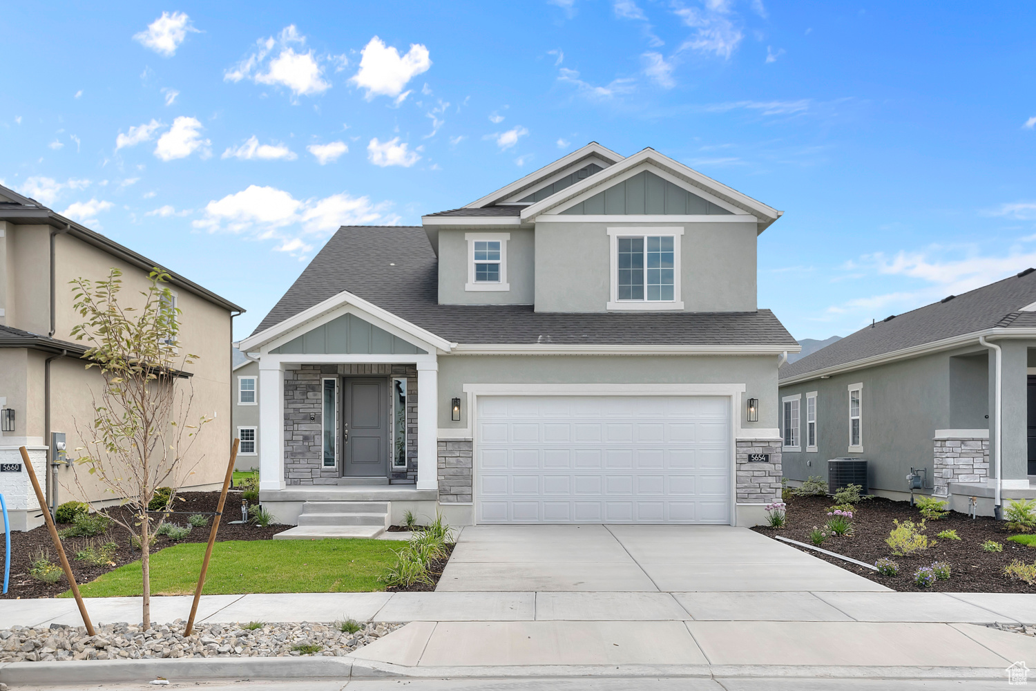Come see this beautiful brand new Jenkins home in a great Stansbury Park community! Features you will find white laminate cabinets, quartz countertops, and stainless steel gas appliances for a clean, modern kitchen. Flooring includes a mix of laminate hardwood, tile, and carpet, paired with can lighting to brighten living spaces. Thoughtful details include a half wall at the stairway, two-tone paint, and Craftsman base & casing. The owner's bathroom boasts a walk-in shower with glass doors, accented with satin and brushed nickel hardware. A tankless water heater and energy-efficient options complete this beautiful home along with full yard landscaping for a turn key experience!