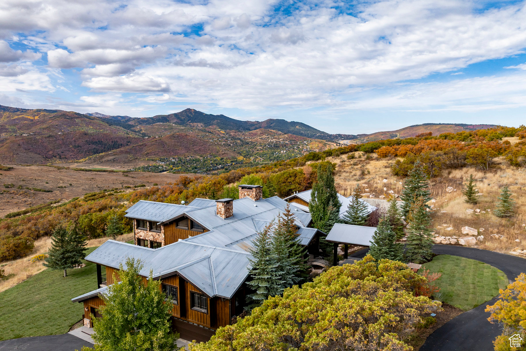 Step into a storybook home where Park City's rugged mining past meets timeless European elegance. Imagined as if a hardworking turn-of-the-century miner joined his life with a refined socialite, this residence reflects both grit and grandeur. Built with enduring craftsmanship, the home's warm wood beams, stone accents, and expansive mountain views echo the miner's roots. In contrast, the interiors whisper of sophistication, each space curated as though the lady of the house had traveled through Europe with her decorator, gathering fine furnishings, textures, and design details that layer the home with old-world charm. Set on a private 33 acre lot in The Ranches at the Preserve, the residence offers both seclusion and sweeping vistas of Park City's iconic landscape. A spacious primary bedroom, four additional en-suite bedrooms, home gym, wet and dry sauna and wine room are just a few of the exceptional amenities. Elegant living and dining spaces flow seamlessly into cozy nooks, inviting both grand entertaining and quiet retreat. Thoughtful architectural details blend rustic authenticity with European refinement, making this home truly one of a kind. 1825 Red Hawk Trail is more than a home, it's a narrative, a fusion of history and romance, and an invitation to live surrounded by character, beauty, and the spirit of Park City.