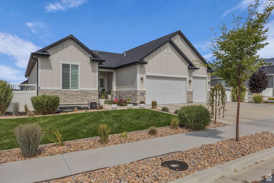 High End Finishes are Sure to Draw you into the Superb Stansbury Park Home. Beautiful Curb Appeal and Large 5  Car Garage  with Additional Side & RV Parking. Upgraded Solid Flooring Flows through Front Entry into the Grand Family Room with Vaulted Ceilings, Bright Windows, Corner Fireplace and Open to the Gorgeous Kitchen. Quartz  Countertops, Loads of Cabinet Space, Black Stainless Steel Appliances and Upgraded Lighting & Electrical Package. Wood Window Shutters Throughout with Power Blinds in Living Room. Grand Main Level Primary Bedroom with Attached En Suite Bathroom with Euro Glass Shower,  Separate Soaking Tub & Dual Sink Vanity. 2 Additional Main Level Bedrooms, Full Bathroom and Large Laundry Room. Room to Grow in the Nearly 1800 Sq Foot Basement.  Oversized Garage has Metal Cabinets, Custom Shelving and Full Epoxied Floor. Yard is equipped with EverLights Custom Lighting. Full Landscaping with Custom Rock Work & 2 Back Patios.  Garden Area with Planter Boxes & Direct Water Source. Fully Upgraded Fencing with Extra Large Gates.  RV Parking with Bluetooth connected Camera overview and Outdoor Shed. Home has Water Softener/Conditioner, Reverse Osmosis Water Faucet, Home Home Humidifier, Ring Doorbell and Large Cold Storage in Basement.  Seller's are offering Carpet Allowance.   Square footage figures are provided as a courtesy estimate only.  Buyer is advised to obtain an independent measurement.  Seller is offering a $5k Carpet credit as the Dyson has taken a toll on the carpet.