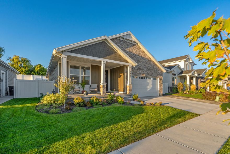Stunning Brad Reynolds rambler in the Meadows on 48th subdivision, just two years old and better than new! This home sits on a generously sized, private lot with full white vinyl fencing, fully finished landscaping, and an inviting covered patio that's perfect for relaxing or entertaining. Mature trees, lush garden and flower beds, stunning black rock pathways, and an automatic irrigation system create a beautifully manicured backyard that's effortless to maintain.  Inside, you'll find nearly 3,300 square feet of luxury main-floor living, featuring five bedrooms and four bathrooms designed for comfort and versatility. Upgrades throughout include alarm system with cameras, quartz countertops, Craftsman-style cabinetry, stainless steel appliances, a walk-in pantry, and thoughtful finishes that elevate everyday living. The primary suite offers a private retreat with a separate tub and shower and double sinks for convenience.  The fully finished basement adds substantial extra living space, including an additional kitchenette-perfect for entertaining, guests, or extended family. Natural light fills the home through large windows enhanced by custom window coverings, creating an open and airy atmosphere throughout.  This plan balances open-concept living with well-defined areas, offering a seamless flow from room to room. If you're seeking modern, move-in-ready comfort with quality finishes, flexible living space, and an immaculate backyard retreat, this home is a rare find in a desirable neighborhood.