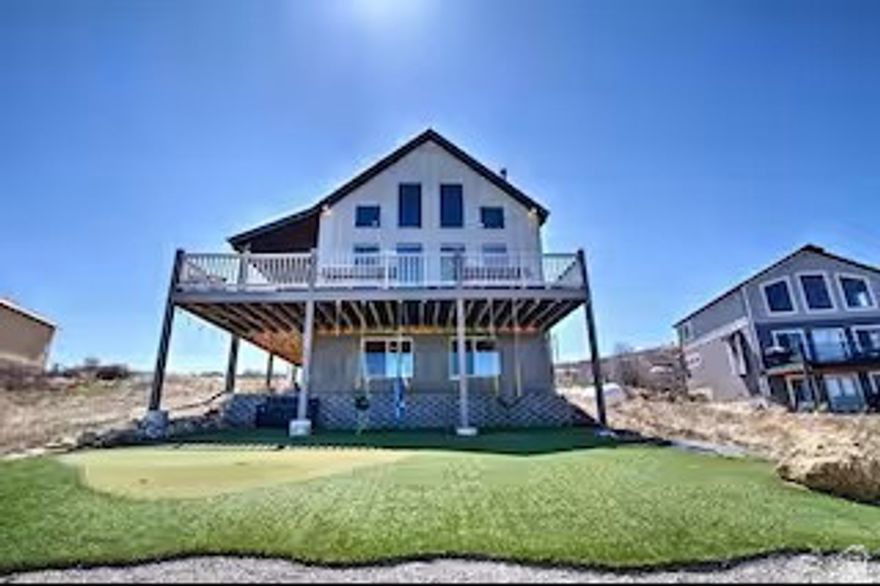 Welcome to this beautifully situated home in the heart of Garden City, offering stunning views of Bear Lake and the surrounding mountains. Located within a desirable HOA community that allows short-term rentals, this property presents an incredible opportunity as a primary residence, vacation home, or income-producing investment.  The home offers approximately 2,575 square feet of living space, featuring a spacious and functional layout designed for comfort and entertaining. Large windows capture natural light and maximize the breathtaking lake views, while the open-concept living areas provide the perfect gathering space for family and guests.  Enjoy easy access to all that Garden City has to offer, including boating, beaches, off-roading, and year-round recreation. Whether you're relaxing on the deck, hosting guests, or utilizing the property as a short-term rental, this home delivers versatility and value in a highly sought-after location. Historical rental income/usage information is available upon request.   Important Notes: Square footage figures are provided as a courtesy estimate only and were obtained from sources deemed reliable; however, Buyer is advised to obtain an independent measurement and verify all information to their satisfaction.