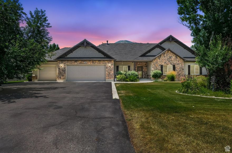 Welcome to this well-maintained, single-level home offering 3 spacious bedrooms and 4 bathrooms. Thoughtfully designed with both comfort and functionality in mind, this home features a formal living room, a cozy family room, and a semi-formal dining area, perfect for both everyday living and entertaining. The kitchen includes a built-in desk/workstation, and just off the laundry room, you'll find a dedicated sewing station or craft area. Plantation shutters add style and energy efficiency throughout. The oversized 3-car garage provides ample storage, and the property offers plenty of space for large animals or horses. Two shares of water are included. Amazing views of the beautiful Wellsville mountains from the back door. Don't miss this rare opportunity-call today to schedule your private showing!  All information herein is deemed reliable but is not guaranteed. The buyer and buyer agent are responsible to verify all listing information, including square feet/ acreage, to the buyer's own satisfaction.
