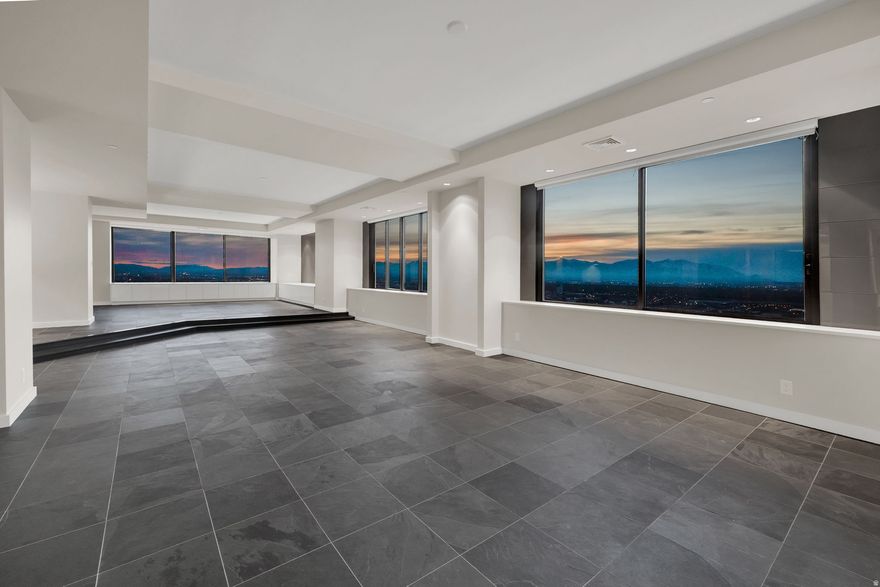 Experience downtown Salt Lake City living at its finest in this one-of-a-kind penthouse, masterfully redesigned by renowned architect Max Smith. Formed from the seamless combination of three units, this extraordinary residence showcases sweeping north, south, and west views, filling the home with natural light. Every detail has been thoughtfully curated, from slate floors to custom Poliform cabinetry imported from Italy and Dornbracht fixtures, creating a refined European aesthetic throughout. A main kitchen and secondary kitchen offer exceptional flexibility, complemented by two laundry areas and a fully separate apartment with its own private entrance-perfect for guests, extended stays, or rental income. The home features three spacious bedrooms, each with panoramic views, and 3.5 beautifully designed baths. Never lived in since its full remodel, this penthouse offers a pristine, turnkey experience. A rare downtown luxury includes three side-by-side parking spaces conveniently located next to the elevator (#353, 354, 355). Residents also enjoy premier amenities including a pool, racquetball court, BBQ area, and a stunning rooftop hot tub with unmatched city and mountain views. Modern. Refined. Unrepeatable. A true statement of elevated urban living.