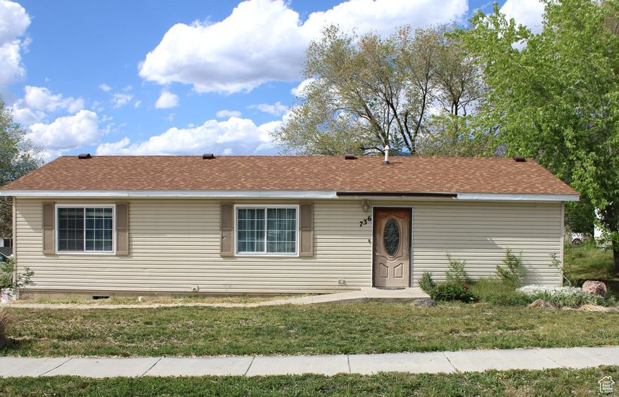 Welcome to this adorable single-level 3-bedroom, 2-bath home nestled on a quiet, no-through-traffic street-perfect for peaceful living. Step inside to find laminate flooring flowing through the kitchen and living areas, complementing the custom-built kitchen cabinets and updated fixtures in both the kitchen and bathrooms. The spacious master suite includes its own private bath, while the dedicated laundry room offers a generous pantry for extra storage. Enjoy stunning mountain views from the spacious backyard, with plenty of room to relax or entertain. A double driveway provides ample parking, and a large shed offers even more storage solutions.  This home is the perfect blend of comfort, function, and style-don't miss your chance to make it yours!