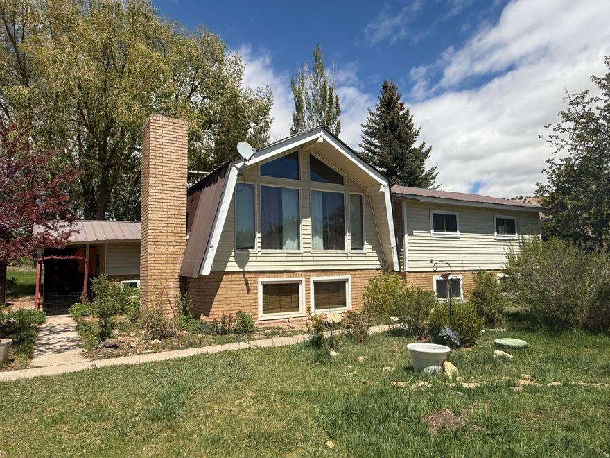 UTAHN!  HIGH DEMAND, LOW SUPPLY AREA!!!  On Highway 35.  Highway 35 is between Tabiona and Duchesne.  This home is about a half mile east of the Utahn Bridge over the Duchesne River, and on the north side of the road. Beautiful, fully fenced property has a huge yard with mature trees and fruit trees, all watered with 1/2 share of water! This very comfortable home has 5 bedrooms, 3 baths, 2 kitchens, and 2 laundry rooms.  It is set up for potential separate living on each of the 2 floors!  Perfect for a large family, multi-family, multi-generational family, a rental, or potential duplex!  It has a well, septic, power, and a 1/2 share of water! There are 2 carports and the property is fenced and gated.  The front and back yards are lush with green grass, a small orchard, and plenty of room for a garden!  A beautiful covered back deck overlooks the neighbor's farm!  This place is soothing and it is easy to show!  Give us a call today!