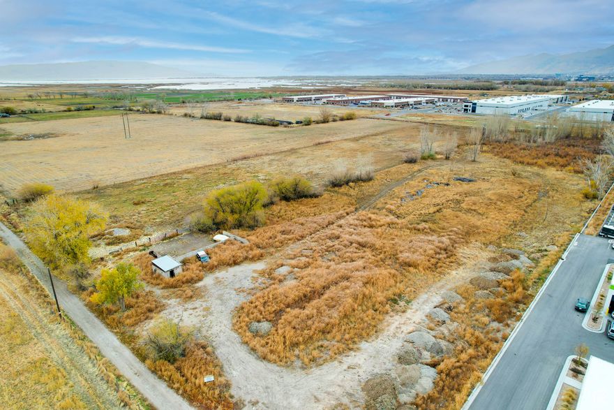 An exceptional investment opportunity awaits with this prime piece of raw ground in Springville, Utah, located just west of Interstate 15. This property is strategically positioned adjacent to the upcoming Lakeside Landing Project, set to break ground in Spring 2025. The Lakeside Landing development will feature a vibrant mix of commercial and residential spaces complemented by recreational amenities, making this a hub of activity and growth.  With quick and convenient access to Interstate 15, this property is perfectly situated for future development, offering endless possibilities for commercial, residential, or mixed-use projects. Don't miss your chance to secure this valuable location in a rapidly evolving area! Includes parcel# 23-028-0042